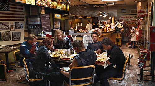 The Avengers eating together at a diner gif