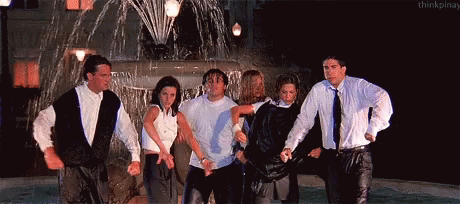 The Friends cast in front of a water fountain gif