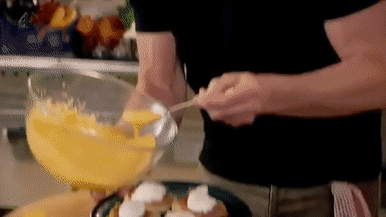 man preparing a breakfast dish