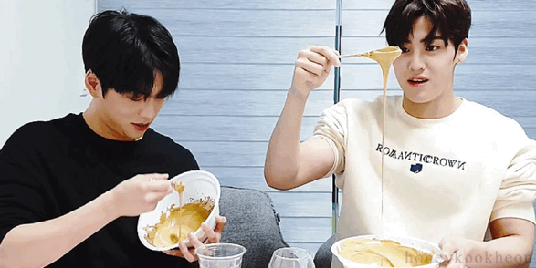 two men making food and laughing