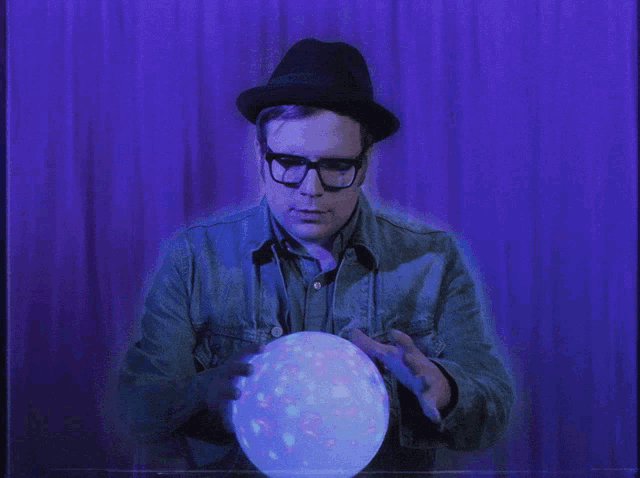 man reading a crystal ball 