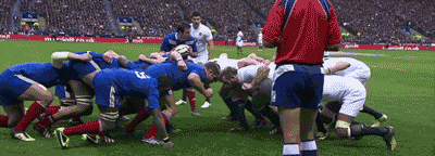 two teams playing rugby on the field