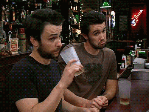men making a face while drinking a beer