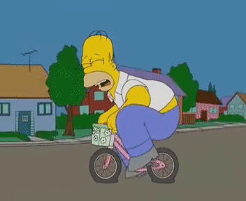 Homer Simpson riding a bike with flat tires