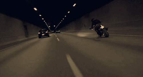 motorcycle dodging traffic