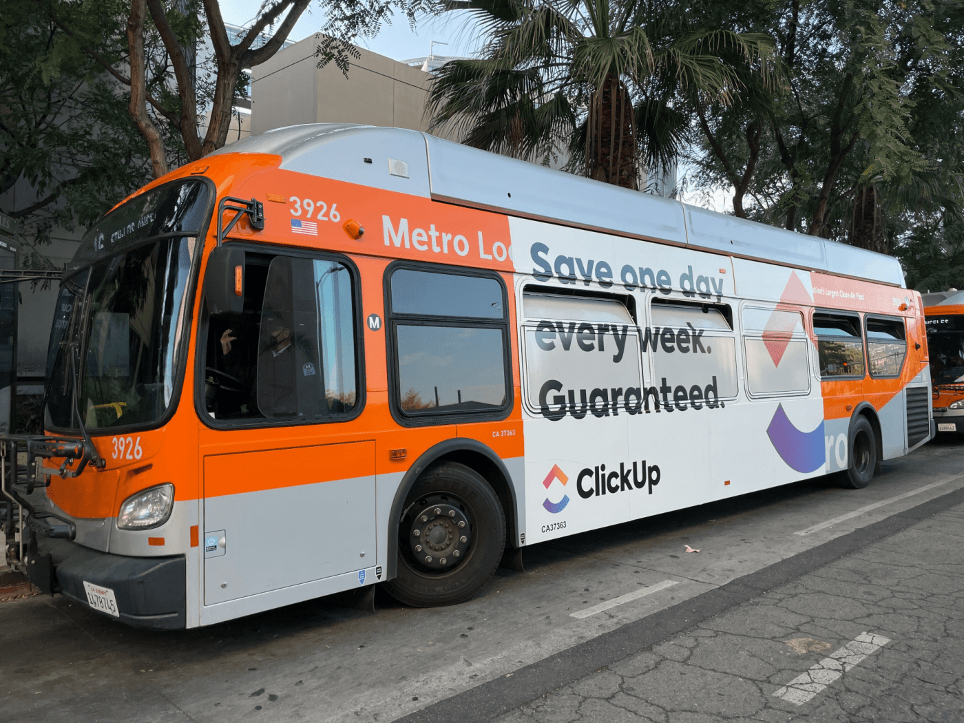 LA Bus with ClickUp logos