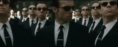 cloned men in suits