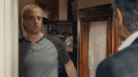 a man shutting the door on someone gif