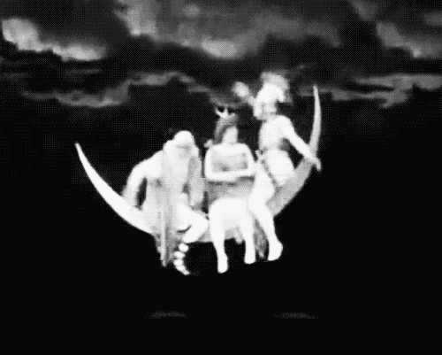 silent film people balancing on crescent moon