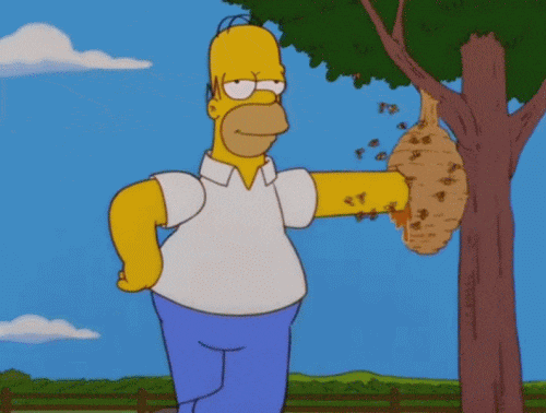 Homer Simpson with one arm in a beehive