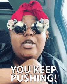 a woman in cool sunglasses saying you keep pushing