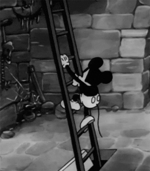 black and white Mickey Mouse climbing up a ladder