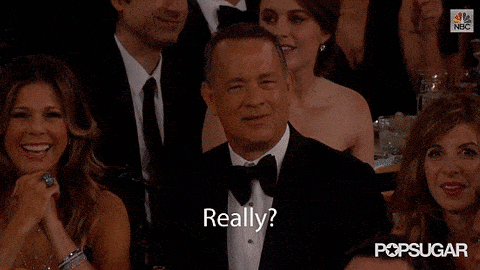 Tom Hanks in a suit asking really