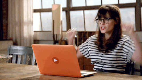 New Girl Jess in front of a laptop