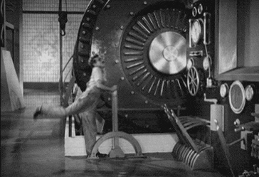 Charlie Chaplin falling on machine lever Modern Times