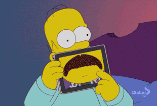 Home from The Simpsons swiping on an iPad for a new mustache look