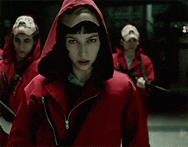 Money Heist, woman in red hood pulling mask over her face