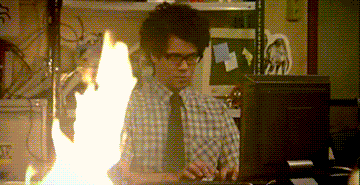 it crowd moss looks at fire while typing gif