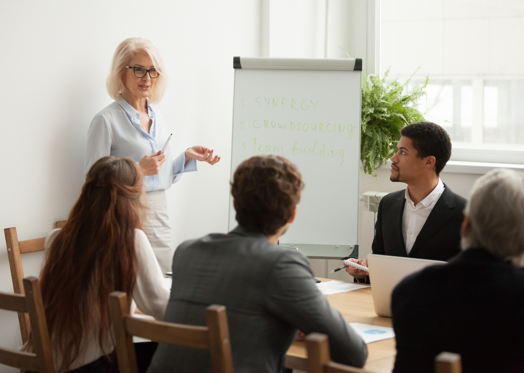 A woman presenting in a meeting