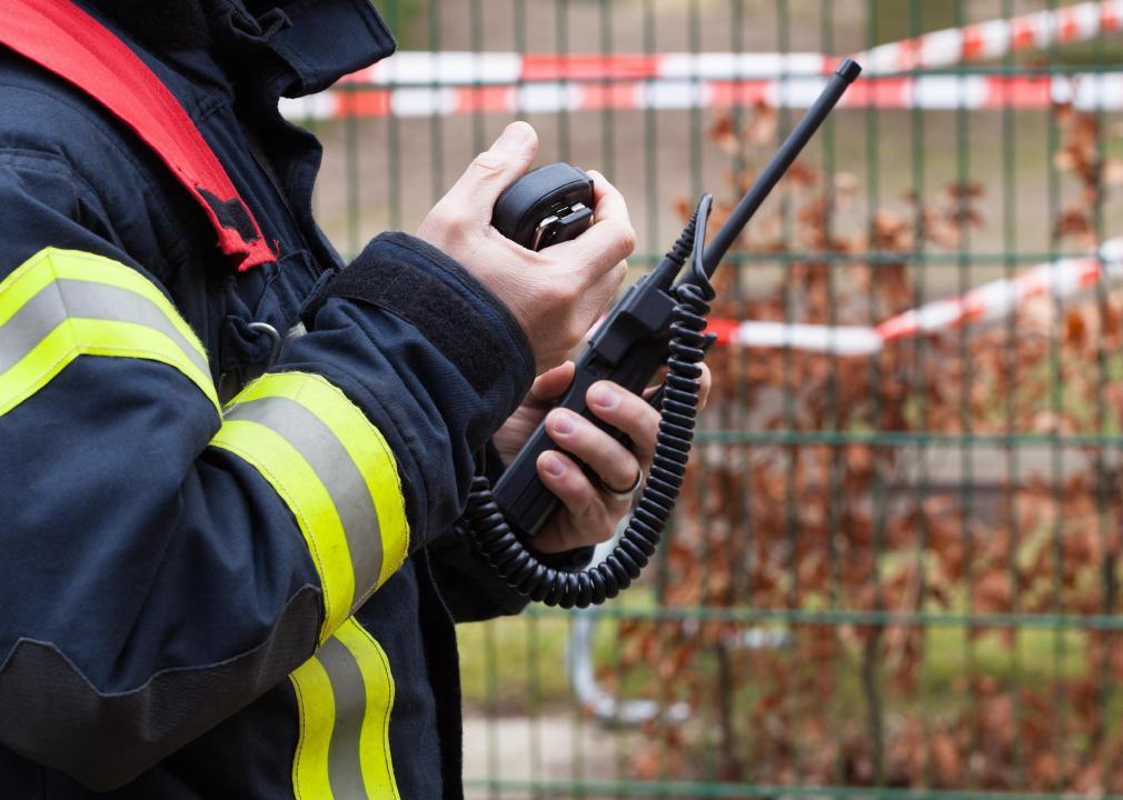 An emergency personnel with a walkie talkie
