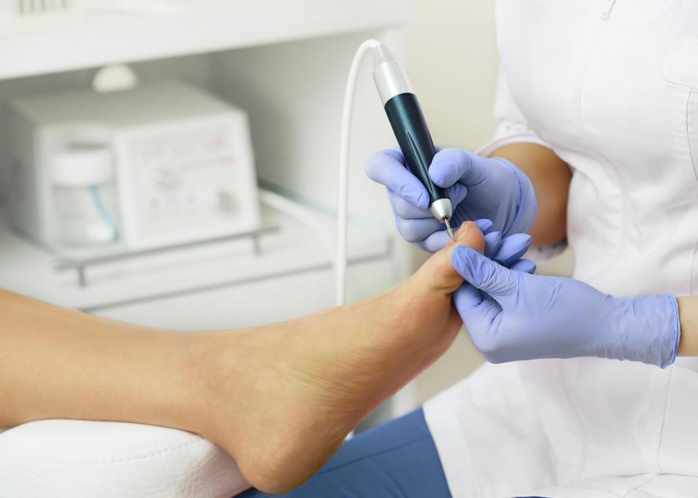 A podiatrist with a patient