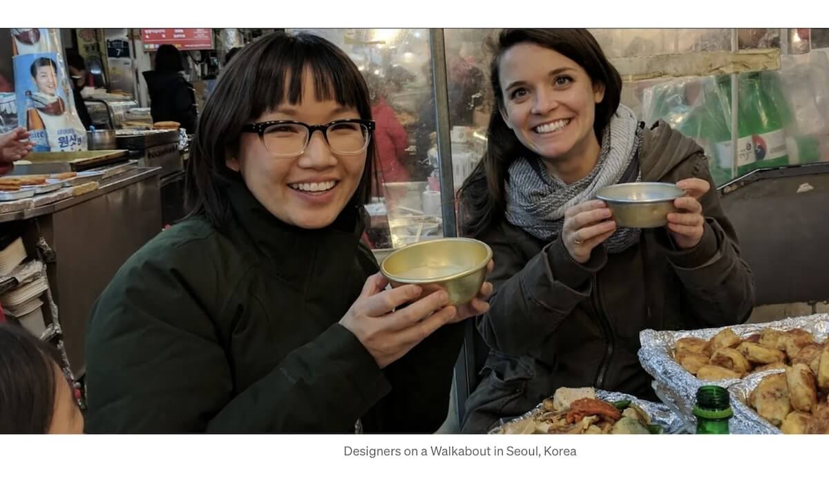 Design process: designers eating outside while smiling at the camera