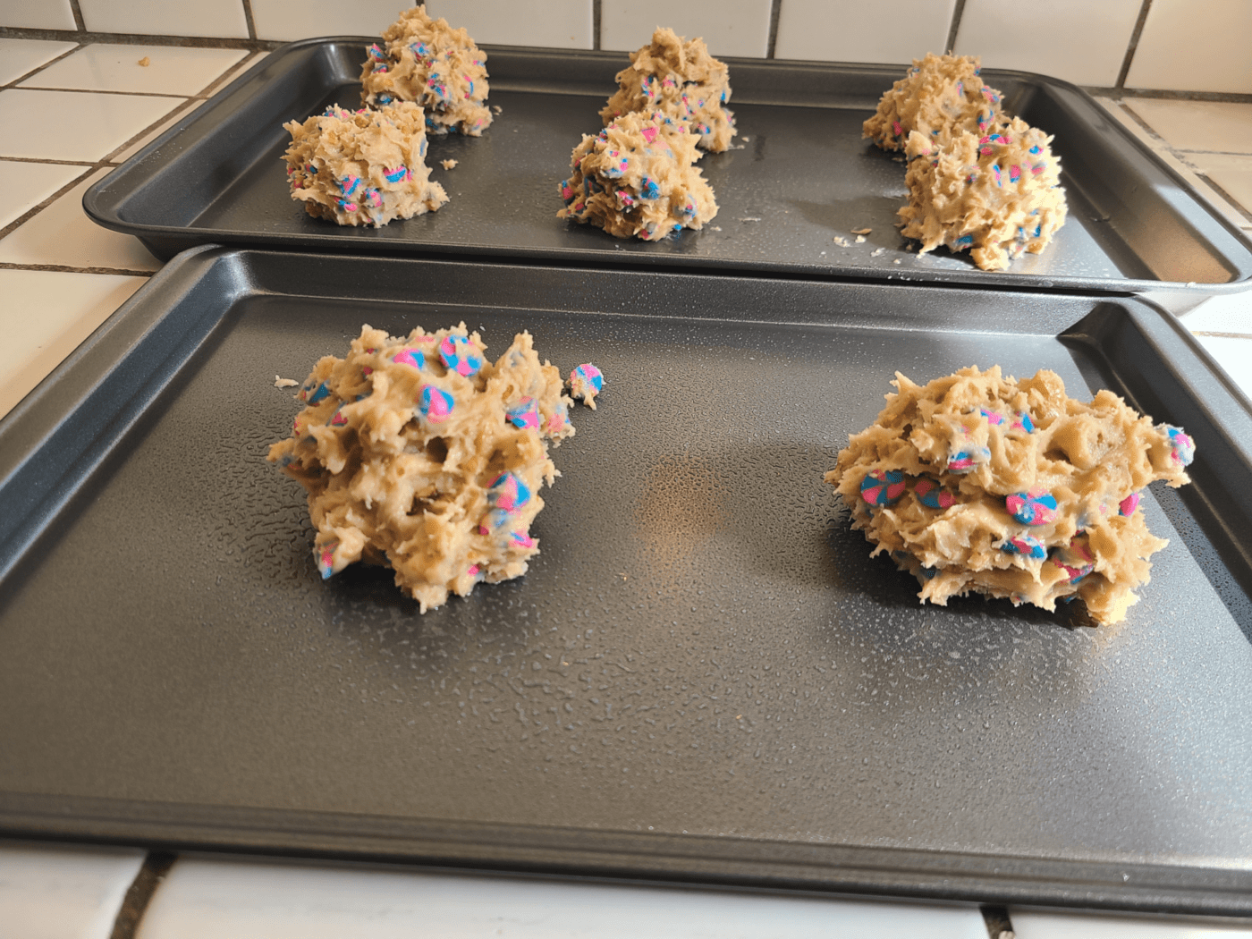 putting cookie dough on baking tray