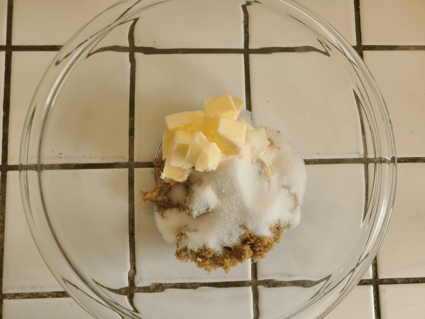 Add butter and sugars into a mixing bowl