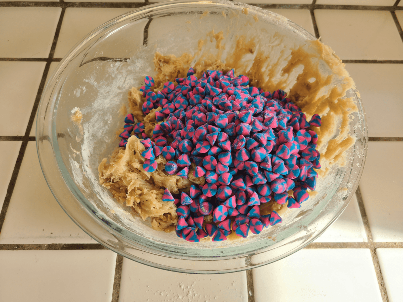 adding chocolate chips to mixing bowl 