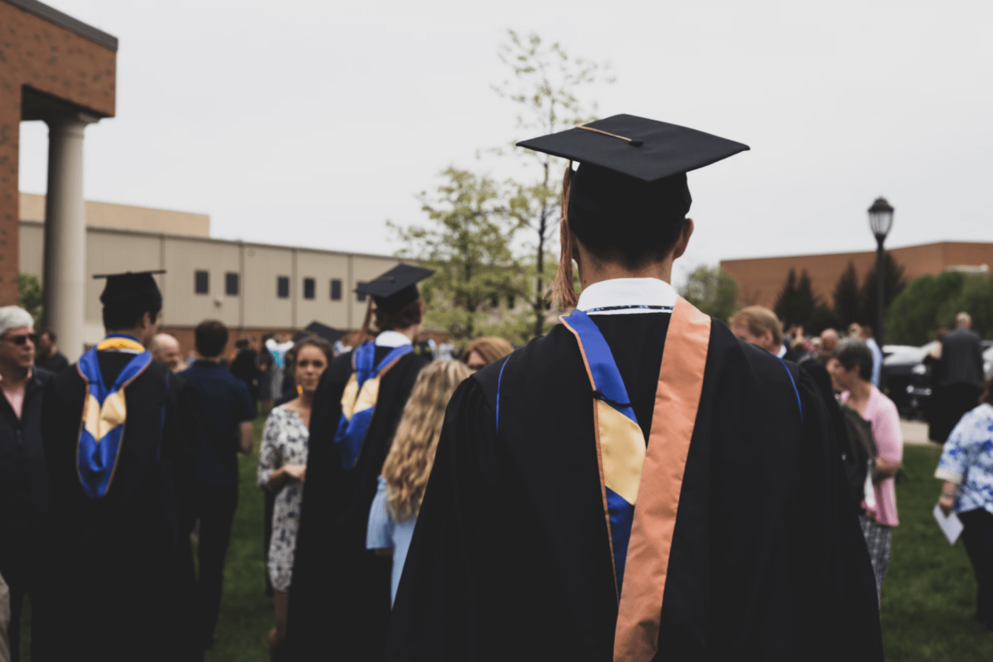 Image of people wearing a graduation cap and robes