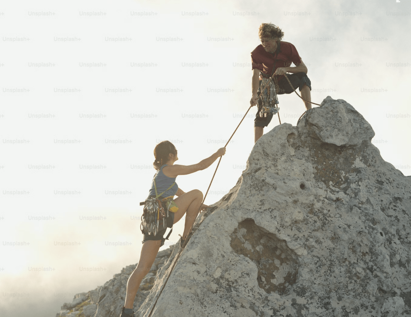 2 people rock climbing