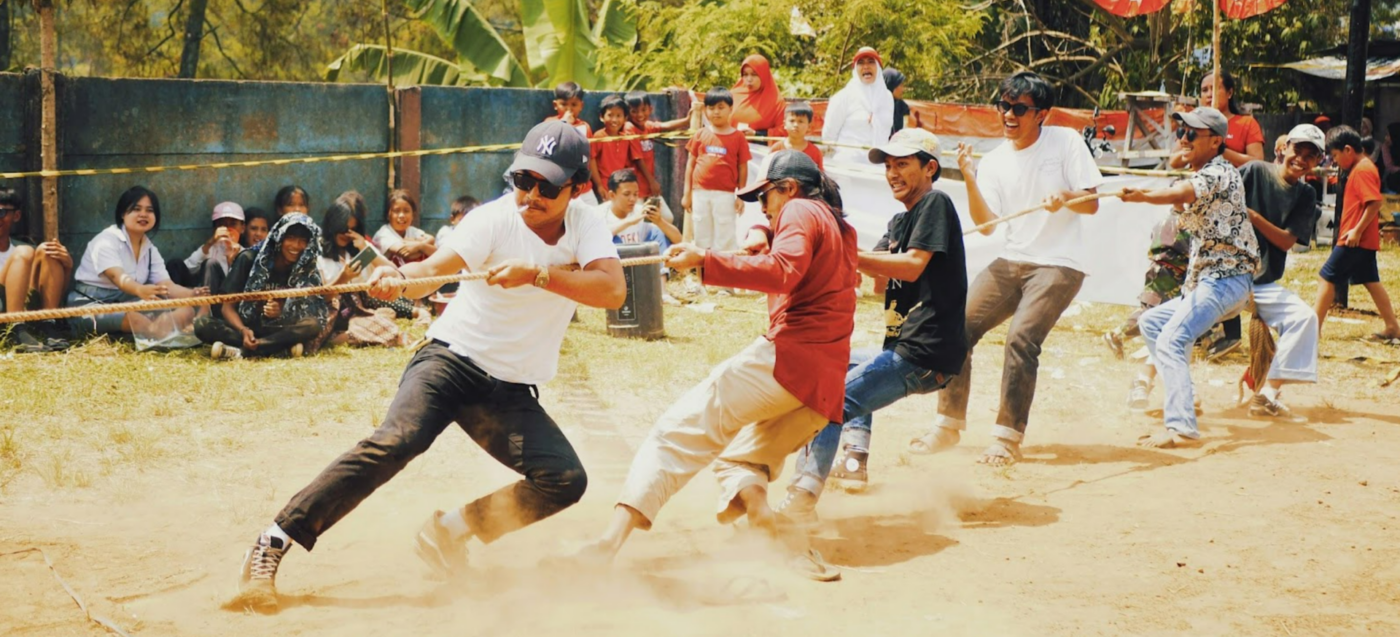 Team playing tug of war